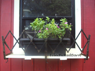 antique model T luggage rack flower box
