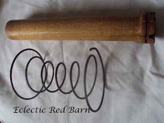Vintage wooden bobbins and old springs 