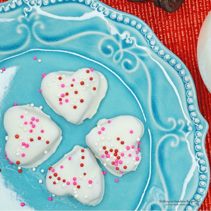 oreo heart shaped truffles on a blue plate