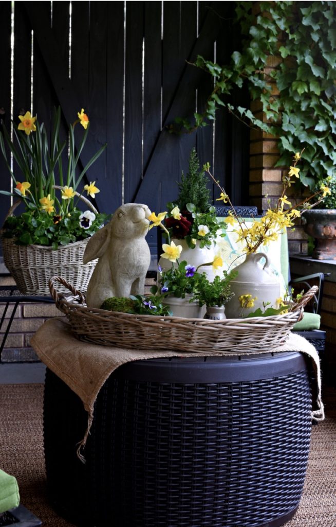 Spring flowers with concrete bunny